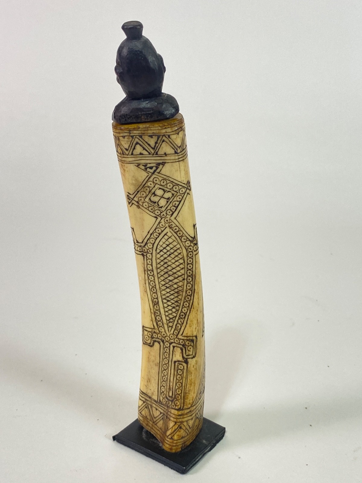 `20th century etched buffalo bone vessel.