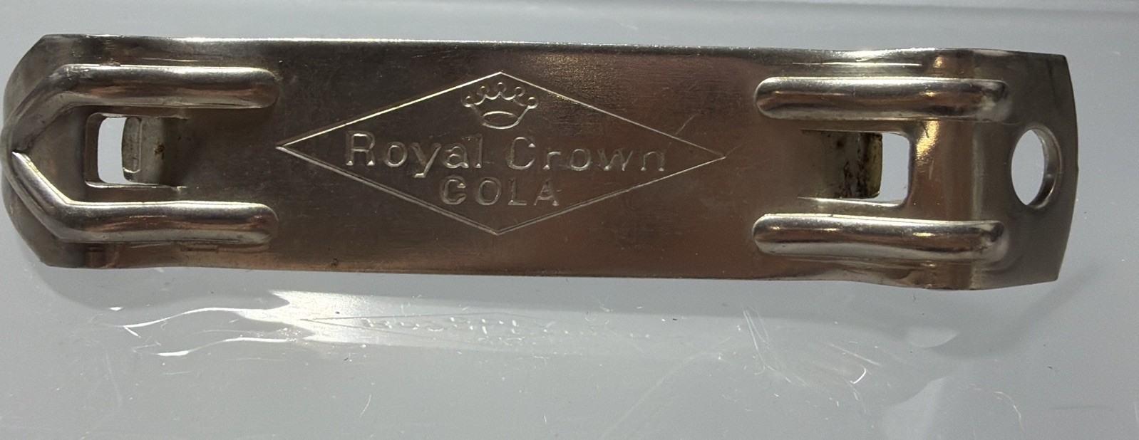 Vintage Royal Crown Cola bottle and can opener is a „church key“ Style