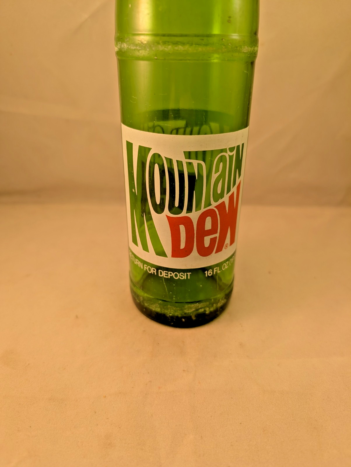 1980s Mountain Dew 16 oz money back acl painted label bottle