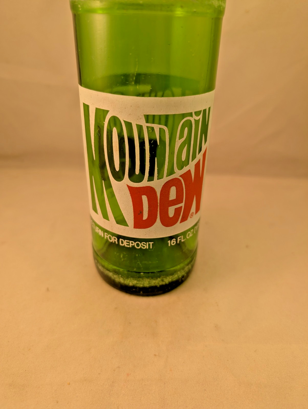 1980s Mountain Dew 16 oz money back acl painted label bottle