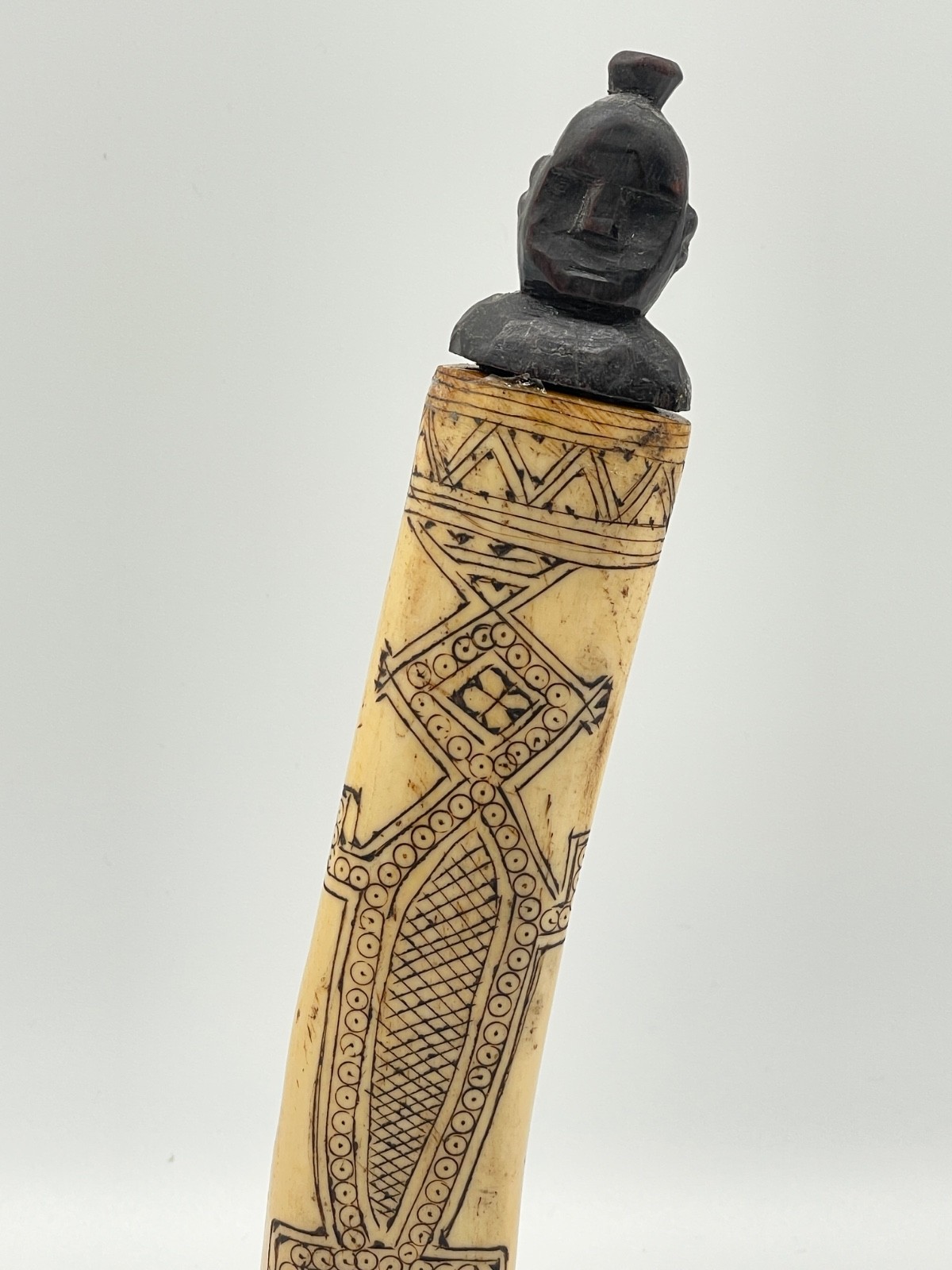 `20th century etched buffalo bone vessel.