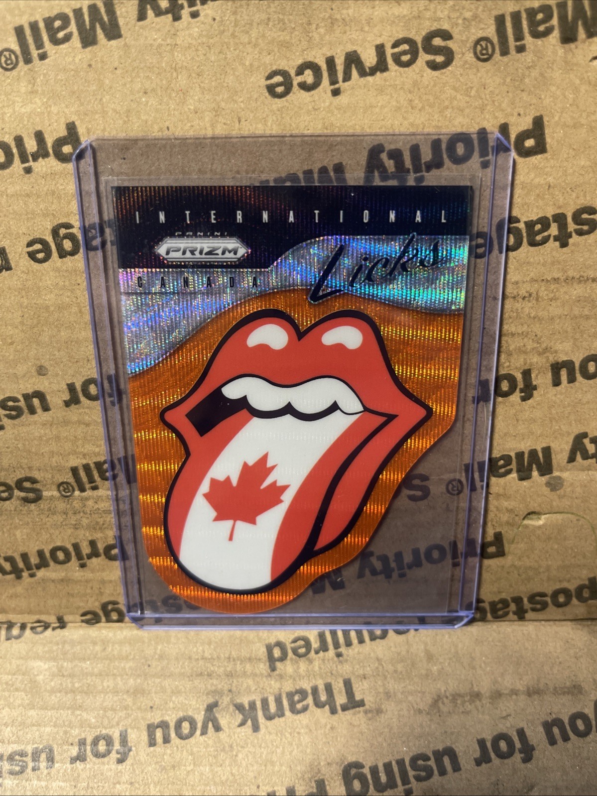 2025 Panini Prizm Rolling Stones International Licks Canada #12 Orange Wave /199