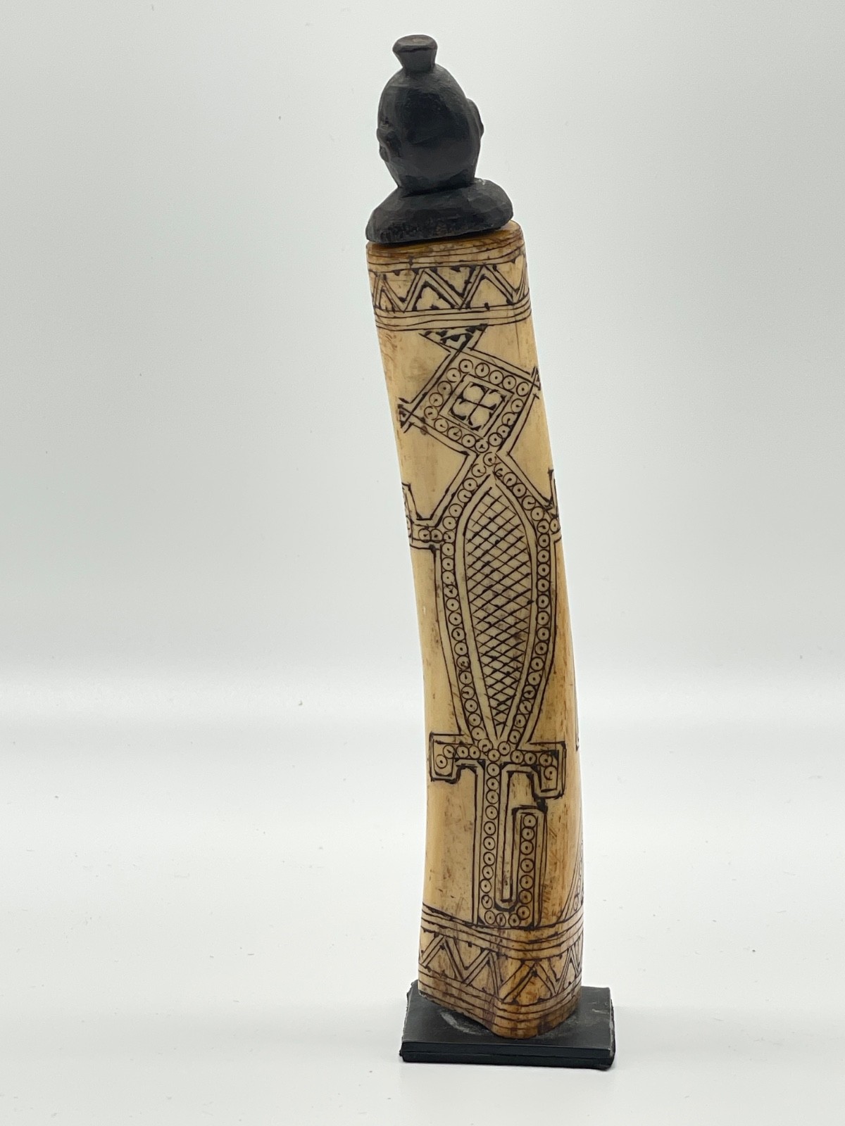 `20th century etched buffalo bone vessel.