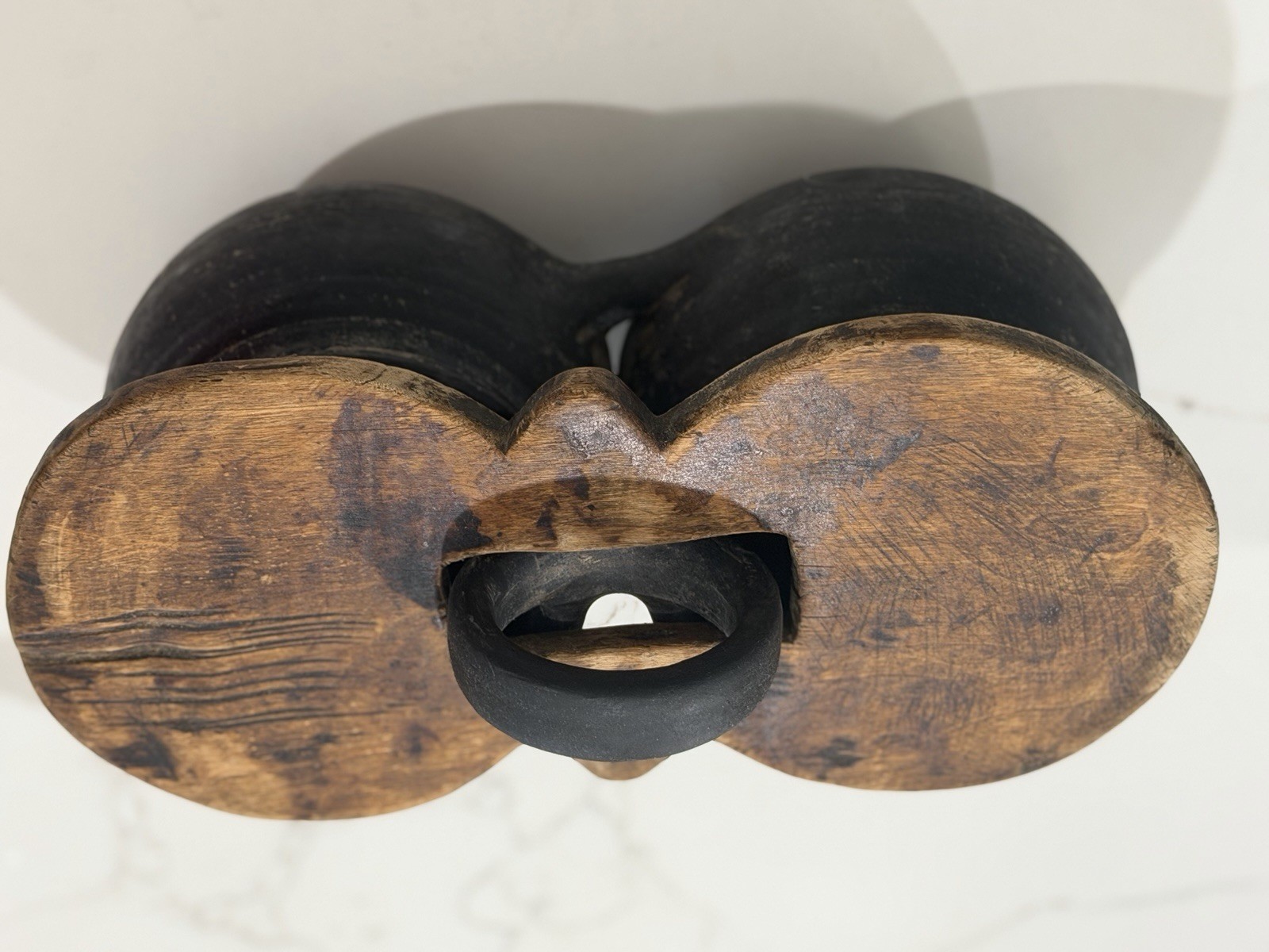 antique,specifically a ceramic double jar with a wooden lid and a black handle.
