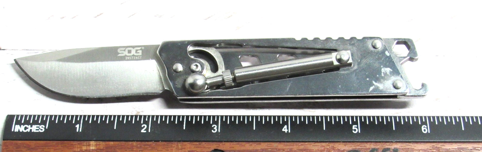 SOG INSTINCT Piston Activated Stainless Steel Folding Pocket Knife-RARE