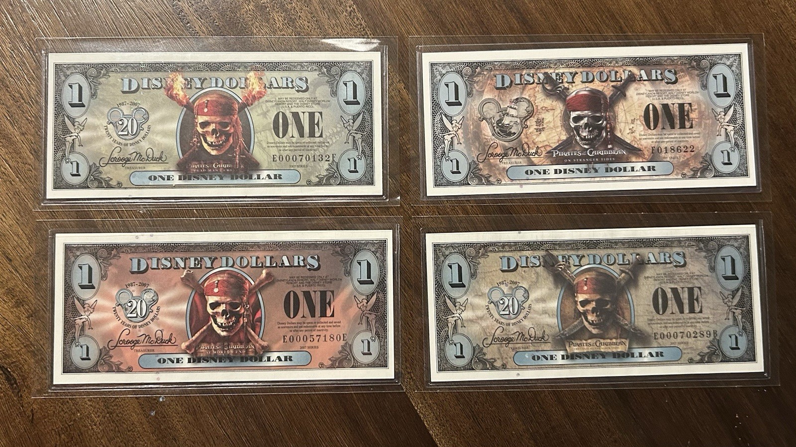 Set All 4 Different Pirate Disney Dollars, 2007 + 2011 Uncirculated + Envelopes