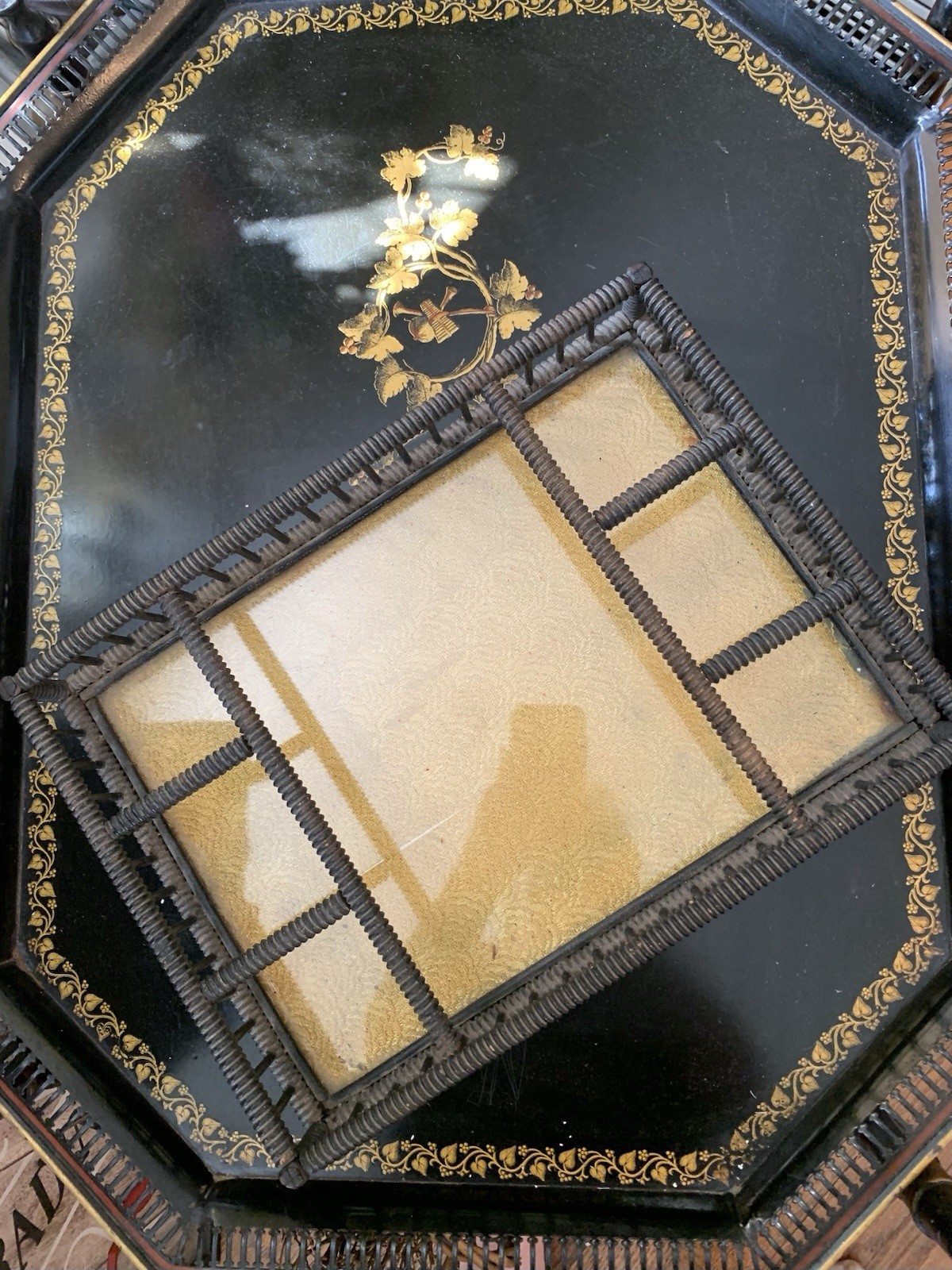 antique glass topped bottom covering gold fabric