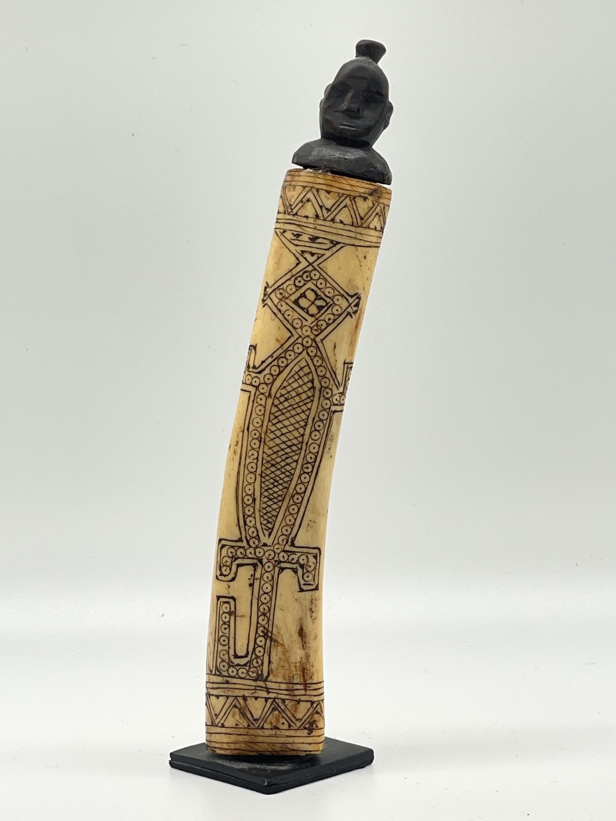 `20th century etched buffalo bone vessel.
