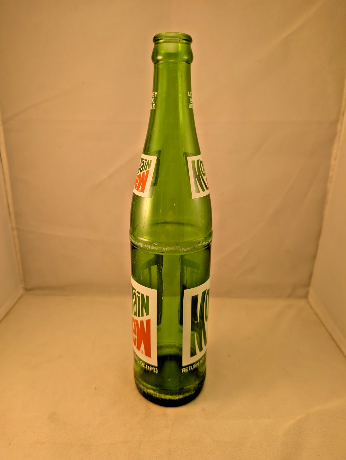 1980s Mountain Dew 16 oz money back acl painted label bottle