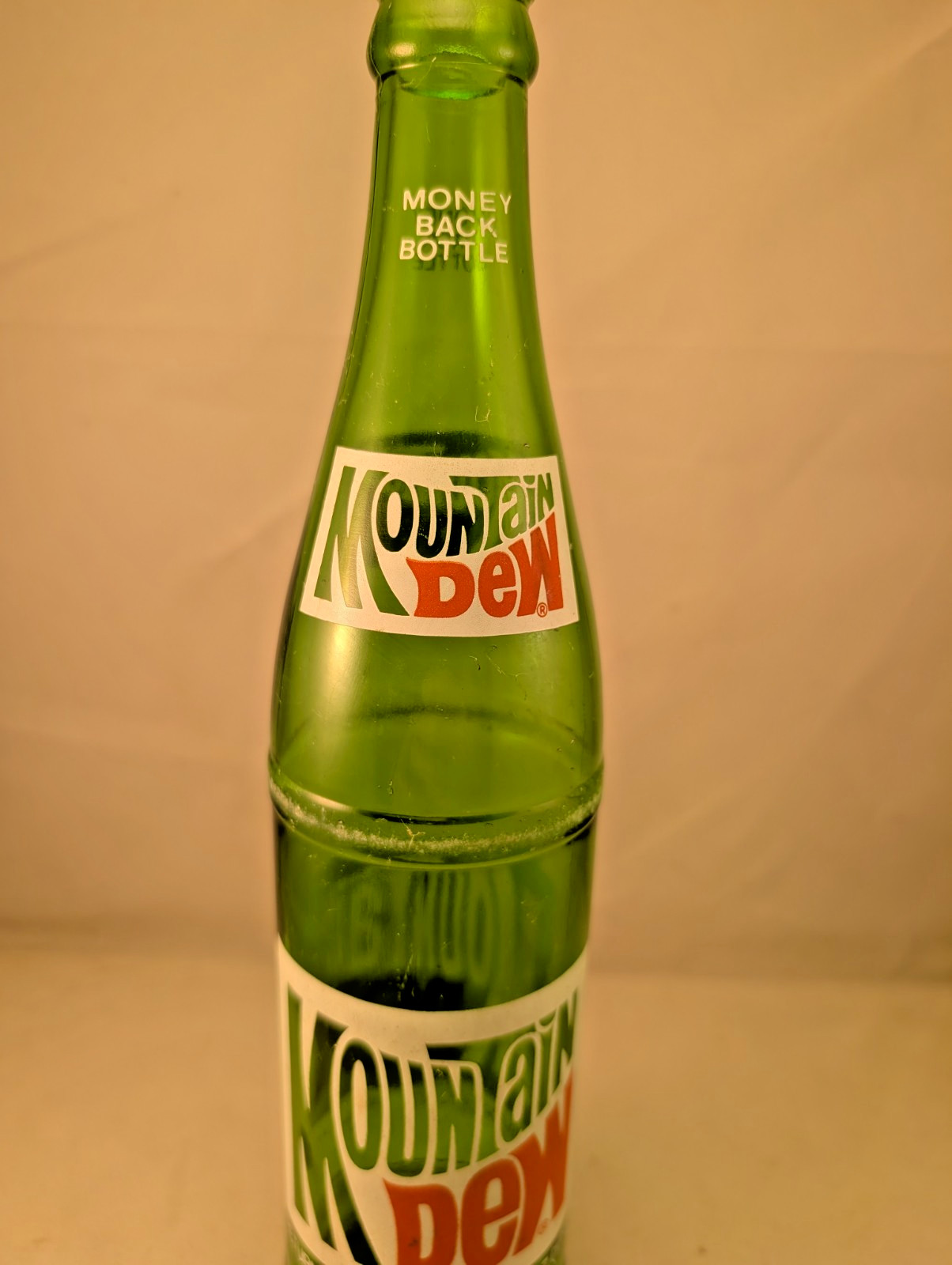 1980s Mountain Dew 16 oz money back acl painted label bottle